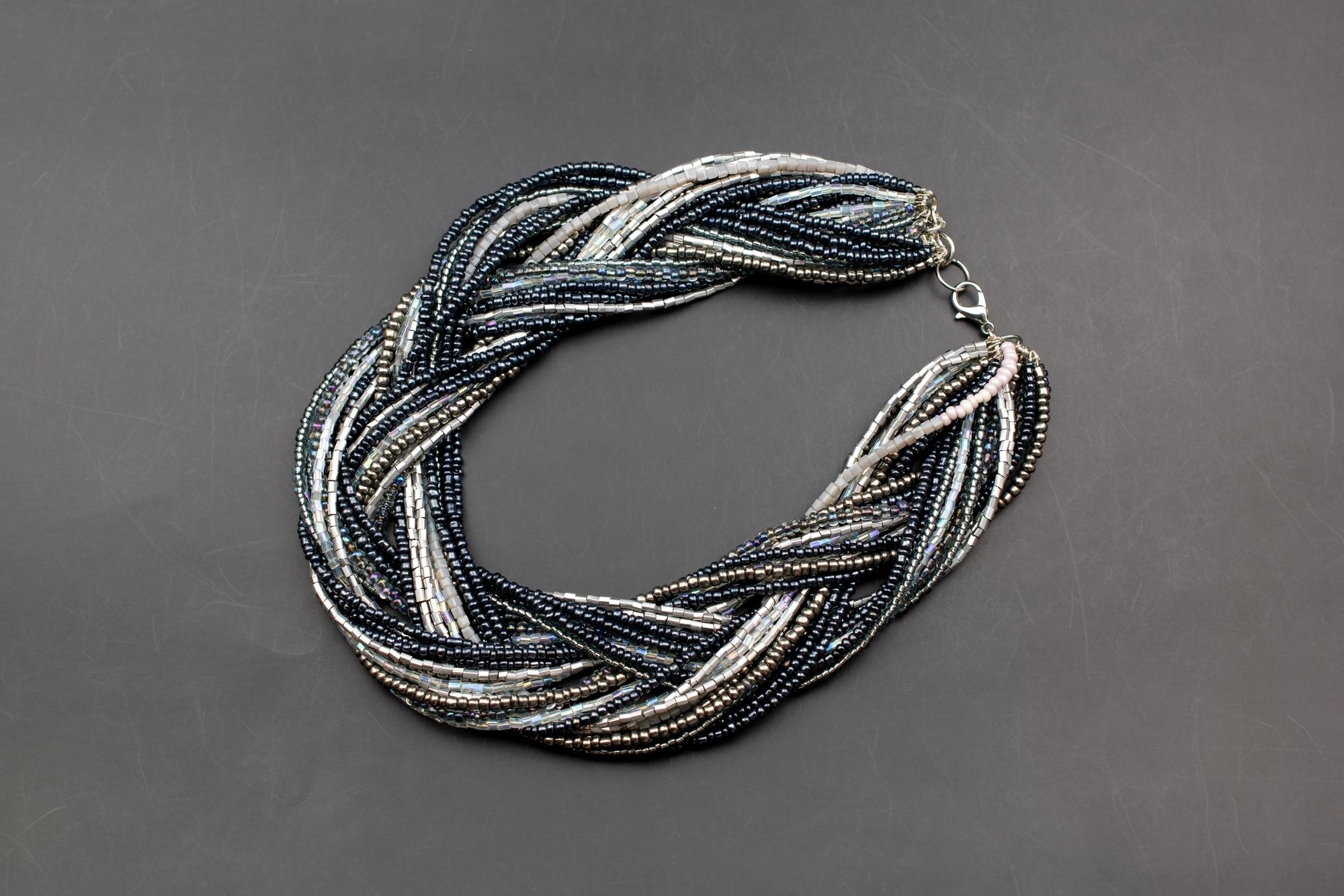 Close detail of metallic thread monogram